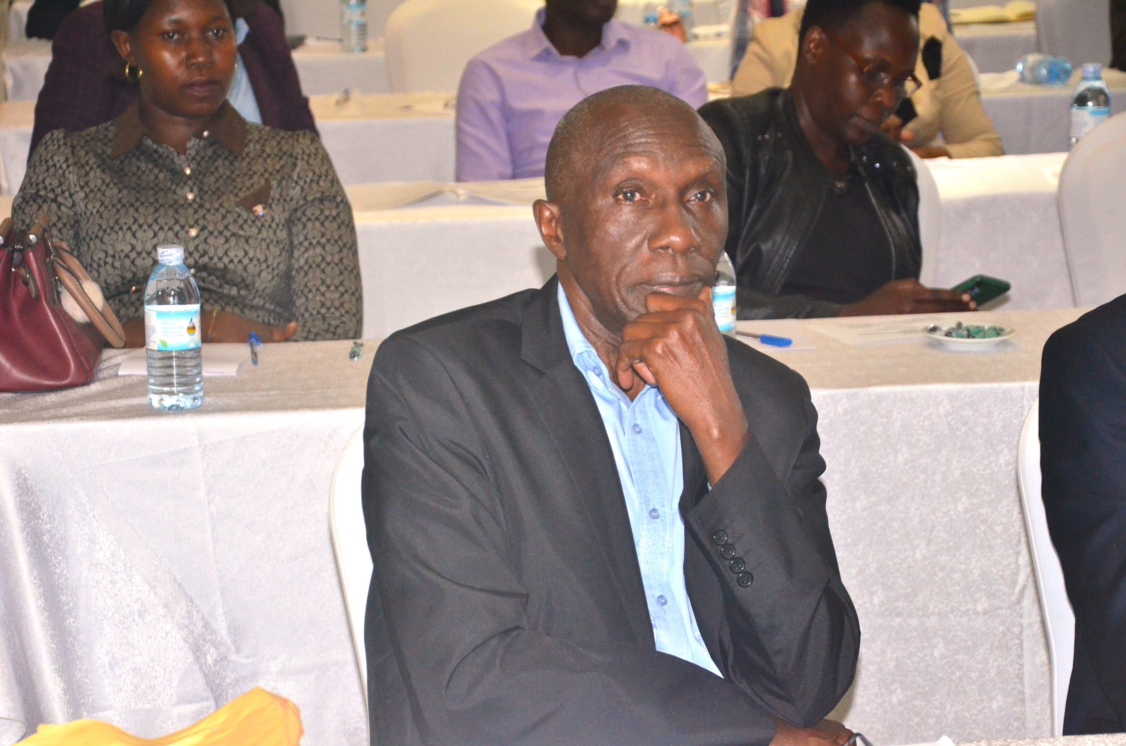 CPA Charles Byaruhanga, Manager Education follows proceedings at the release of the August 2023 examination results.