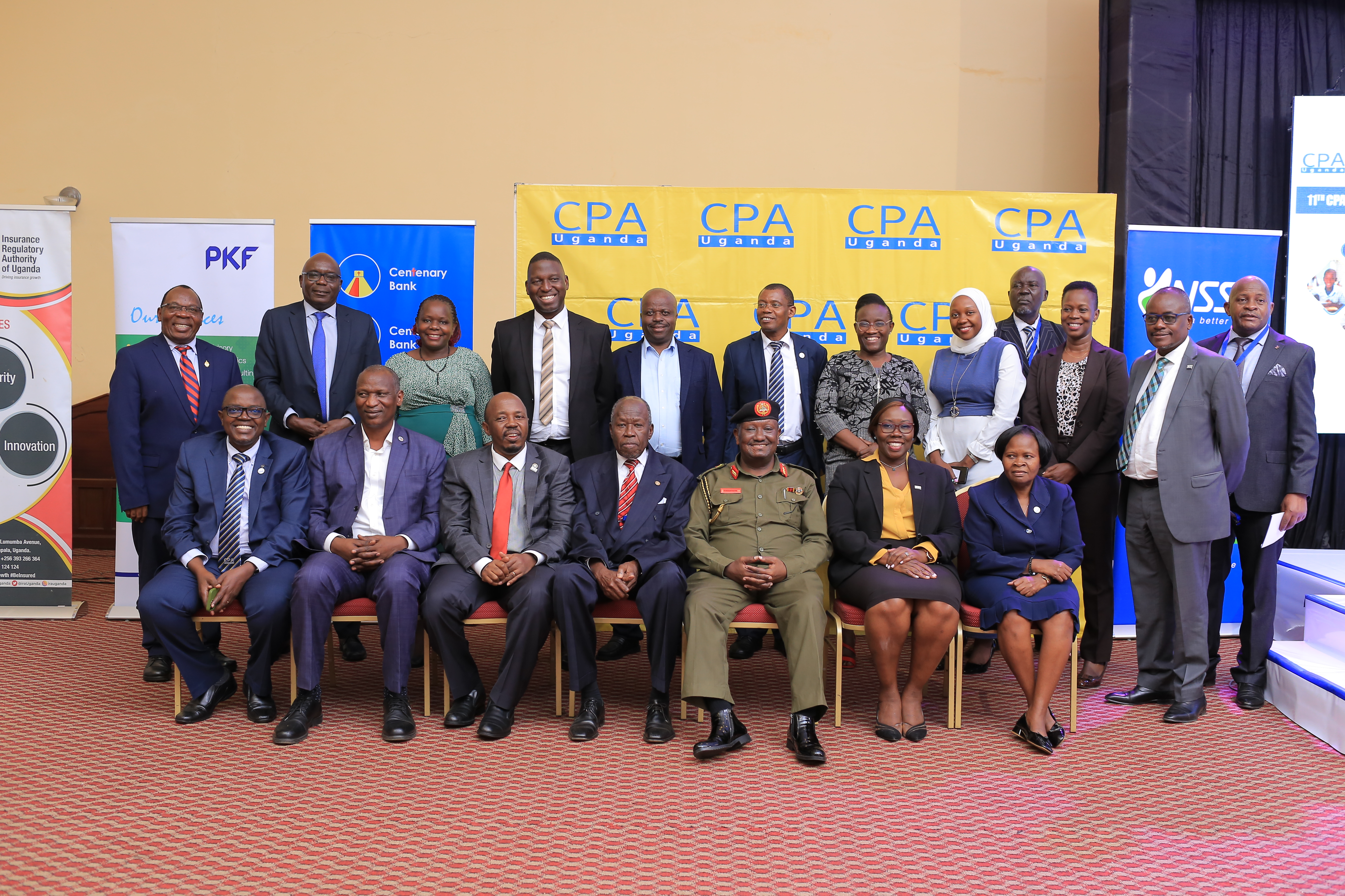 ICPAU President (seated-2nd right), Brig. Gen Felix Kulaigye (Seated- 3rd right) posing for a photograph with some Council Members and ICPAU Past Presidents