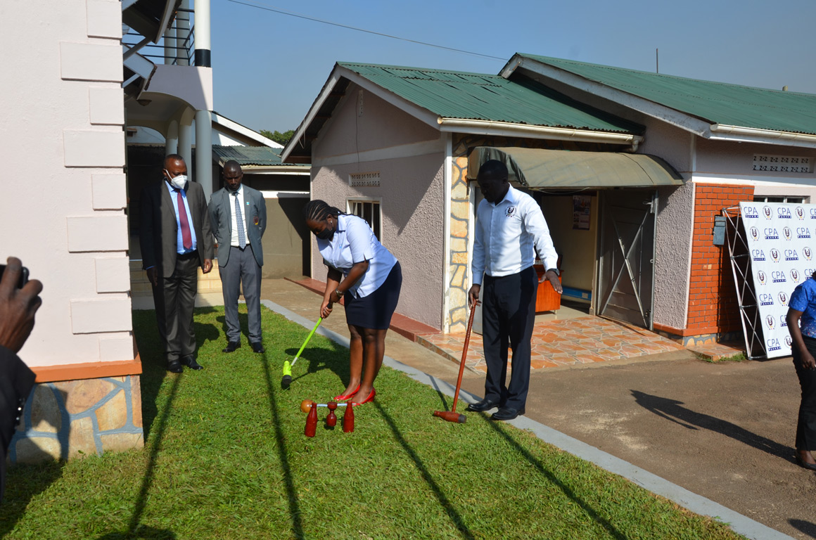 Mrs. Julian Namale Muweesi, ICPAU Official trying out woodball during the press conference