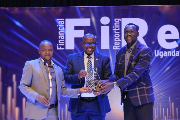 SNV Netherlands Development Organization Limited shines with the 2023 Reporting under IPSAS Award, presented by former ICPAU President, CPA Constant Othieno Mayende (Left). Theu also won the Non-Profit Organisation Award category.