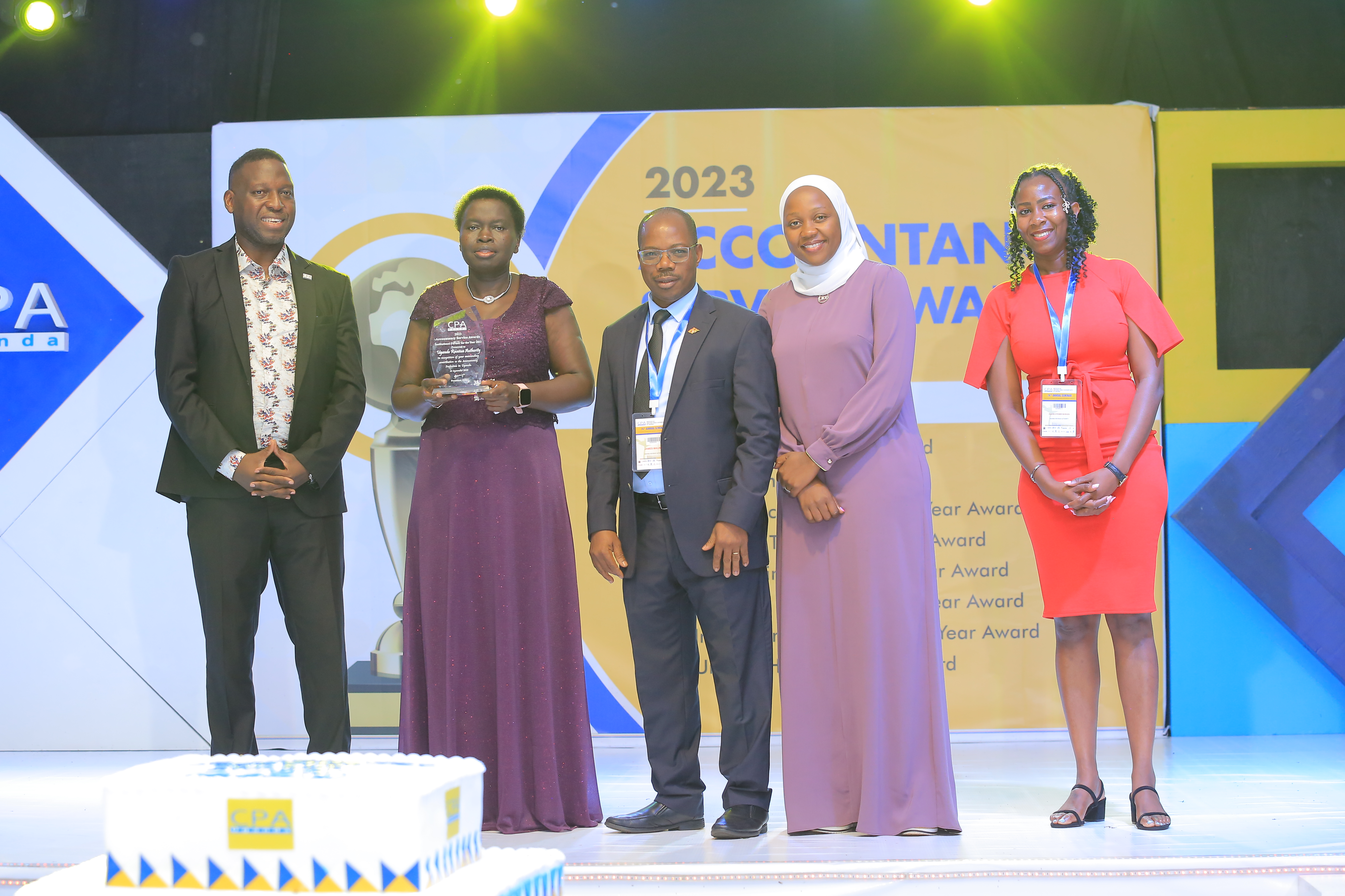 Some staff of URA receiving the Award. Left is ICPAU Council member CPA David Timothy Ediomu.
