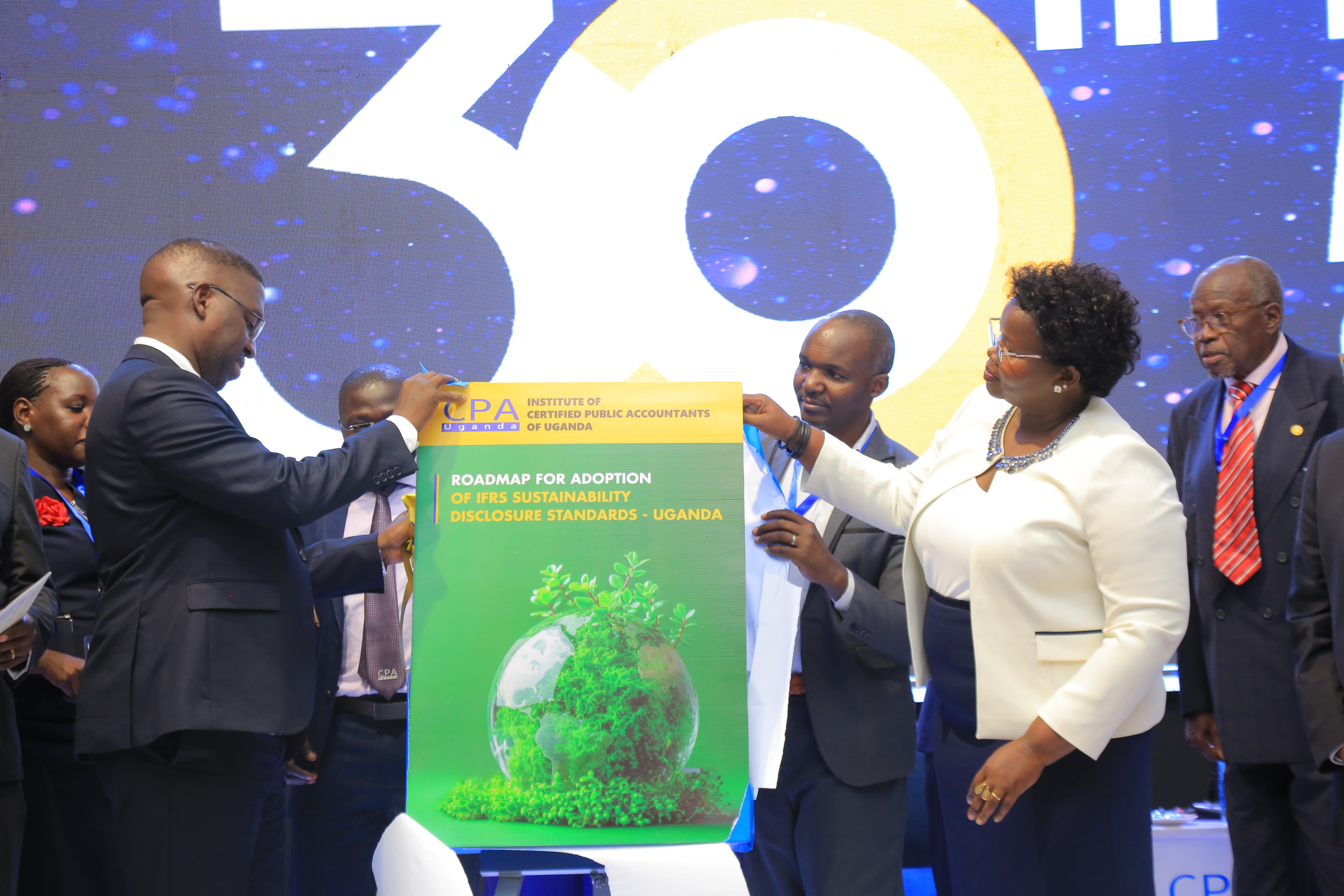 CPA Timothy David Ediomu - ICPAU President with Hon. CPA Faith Nakut at the launch of the road map for implementing the IFRS Sustainability Standards in Uganda.