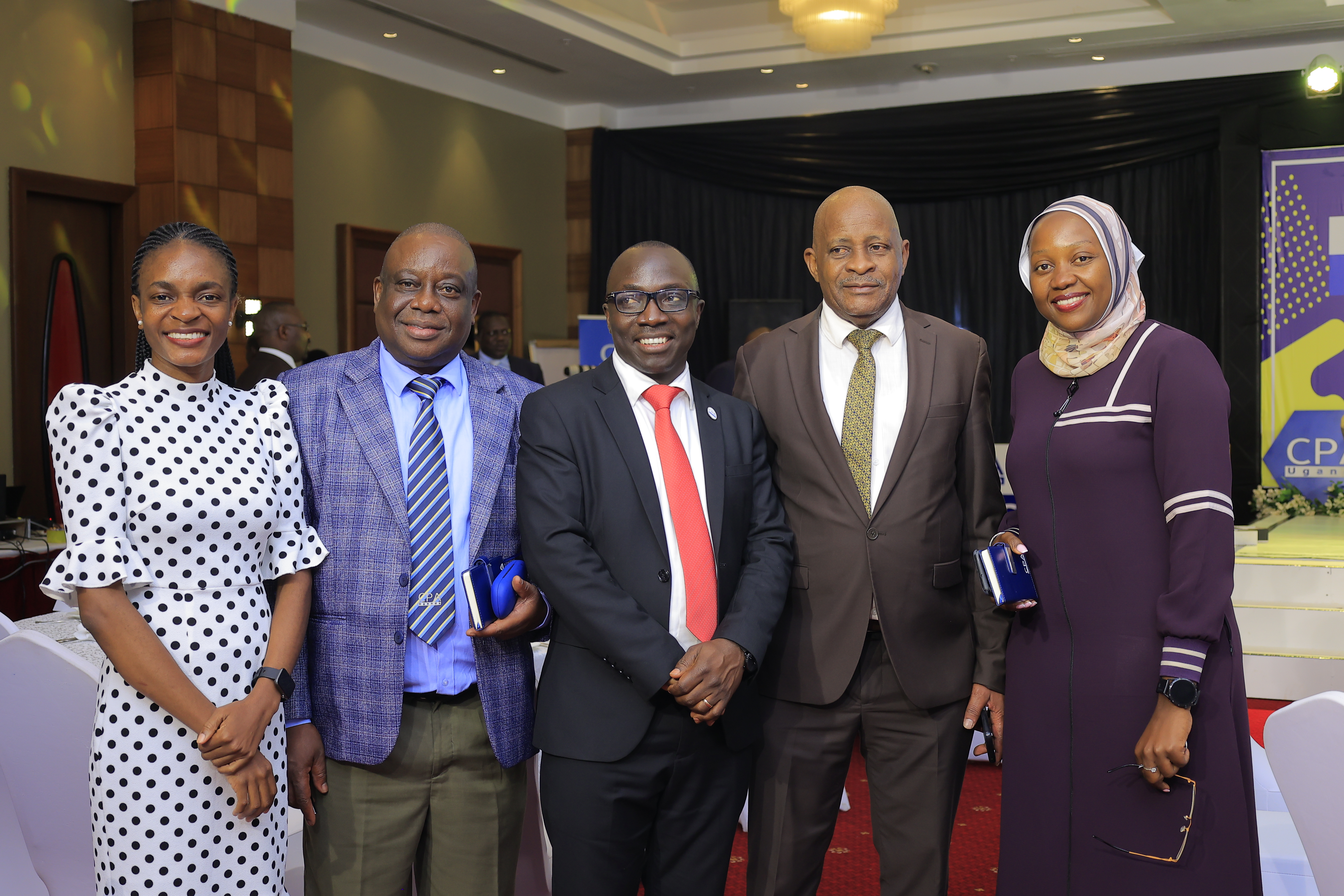 CPA Catherine Zawedde, CPA Paul Rogers Lukande, CPA Charles Lutimba, CPA David Sserebe Bunnya, CPA Rehema Nakirembe and Mr. Angel Ekachellan pose for a photo during the 3rd C-Suite Forum.