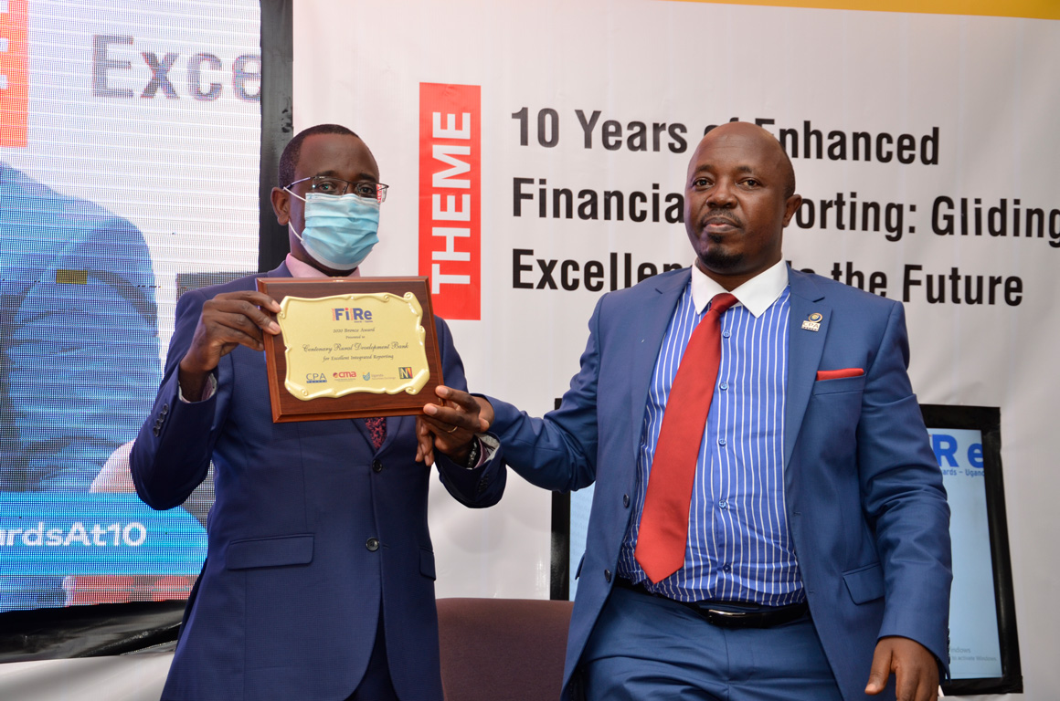 Centenary Bank won the Bronze Award. Left is Finance Manager, CPA Godfrey Byekwaso & Right is CPA Frederick Kibbedi