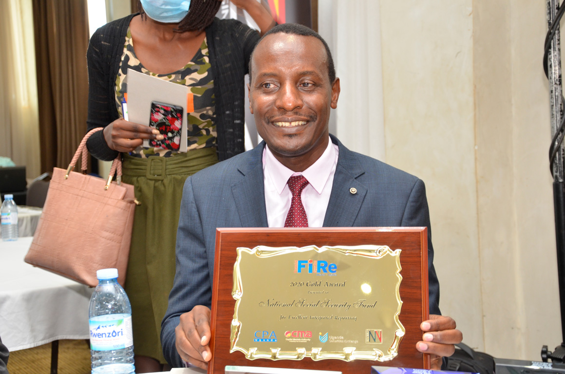 NSSF won the Integrated Report of the Year - Gold Award. Seated is NSSF CFO, Stephens Mwanje