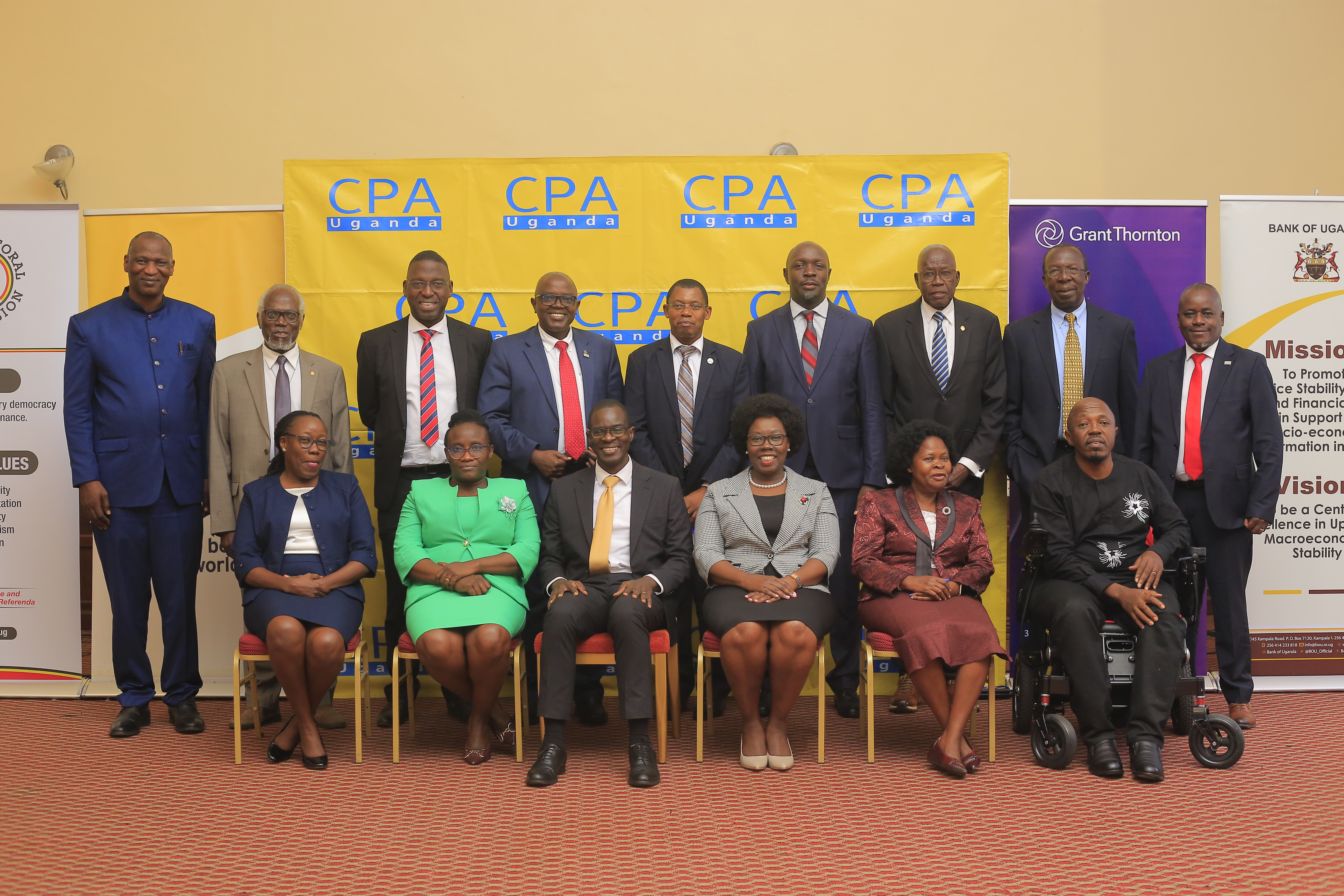 Picture Moment: ICPAU’s Presidents,and Council members with the Keynote Speaker: Standing (L-R) are CPA Protazio Begumisa, CPA Joseph Baliddawa, CPA Timothy David Ediomu, CPA Constant Mayende, CPA Derick Nkajja, Eng Steven Serunjogi, CPAGeorge William Egaddu, CPA David Opio Okello, CPA Ronald Mutumba. Seated (L-R) are  CPA Prof. Laura Orobia, CPA Gloria Tuhaise Wakooba, Mr Joseph Enyimu, CPA Josephine Okui Ossiya, Ms Elizabeth Kateme & CPA Fredrick Kibbedi.