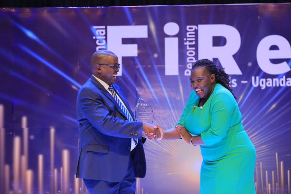 UAP Old Mutual Insurance (U) Limited secures the 2023 Most Improved Report Award, presented by former ICPAU President, CPA Constant Othieno Mayende (Left).